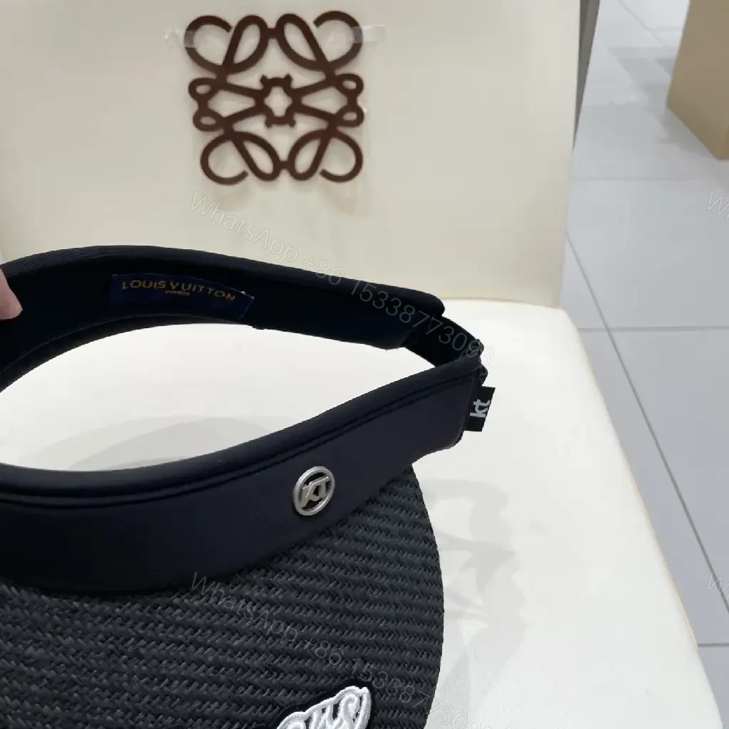 View 2 of Bold Sun Visor with LV Flair: Luxury-Casual Headwear