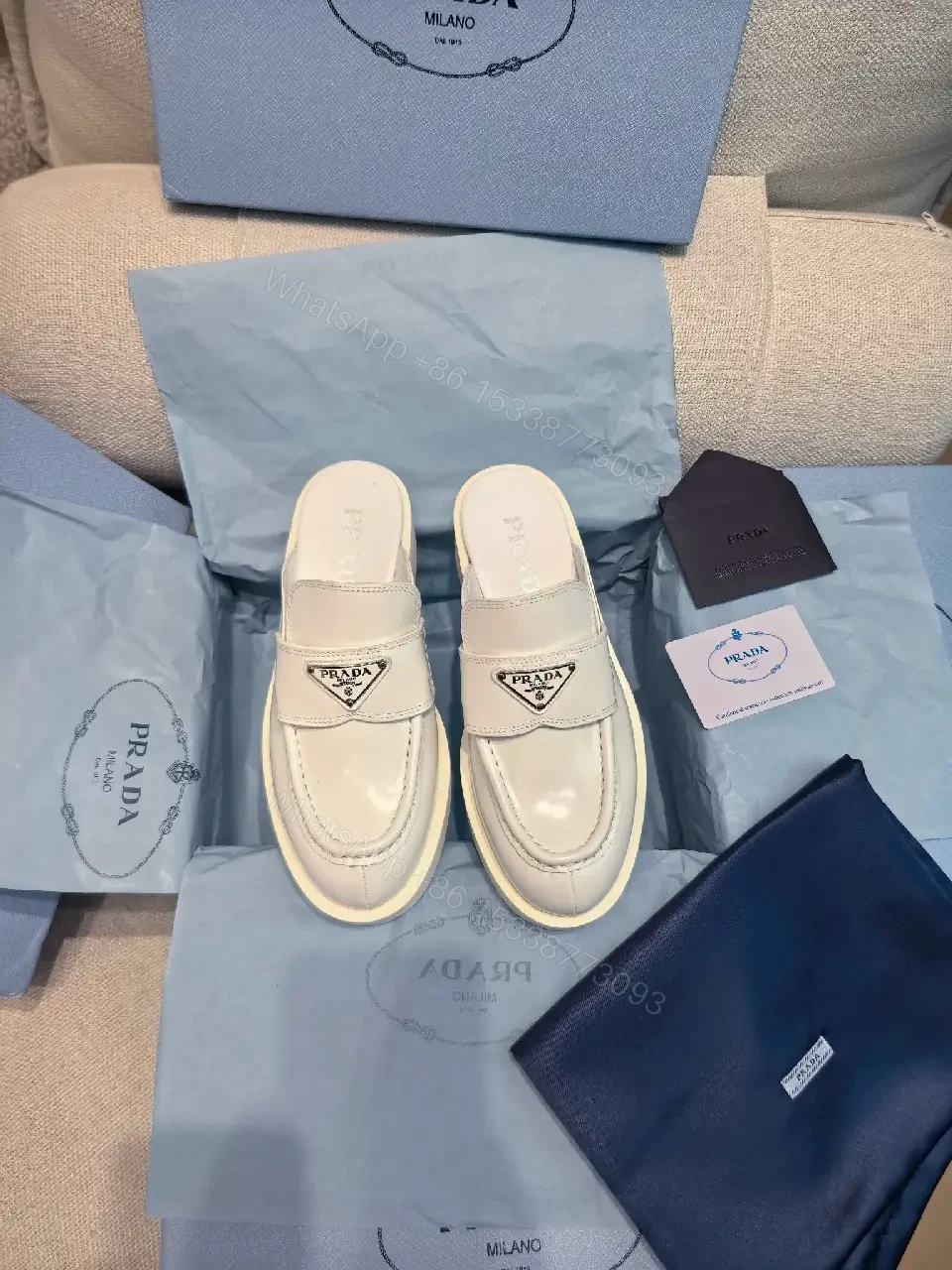 View 5 of White Leather Prada Slip-ons: Classic Padded Comfort Shoes