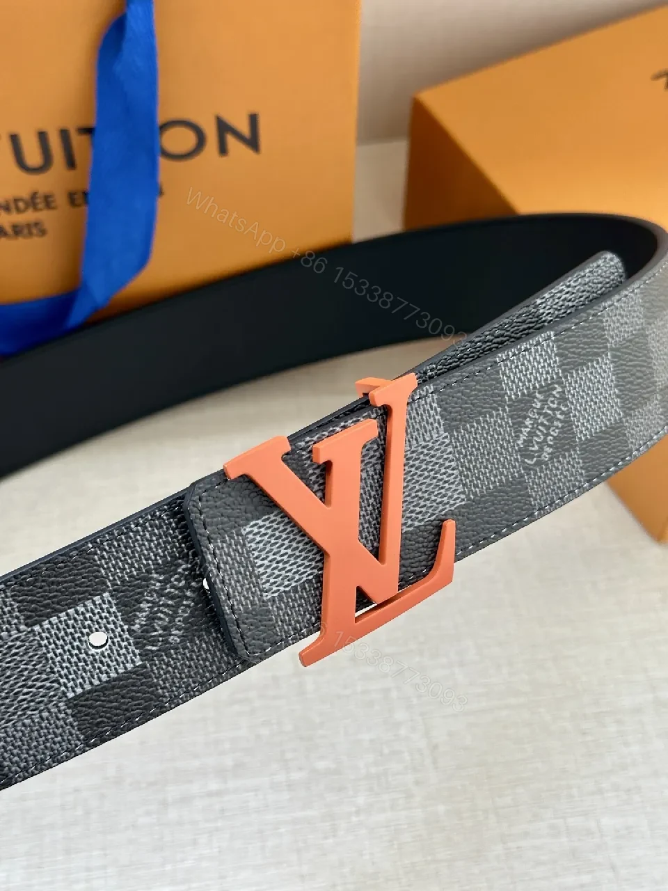 View 2 of Bold Monogram Belt: Coral Buckle, Damier Pattern Leather Belt