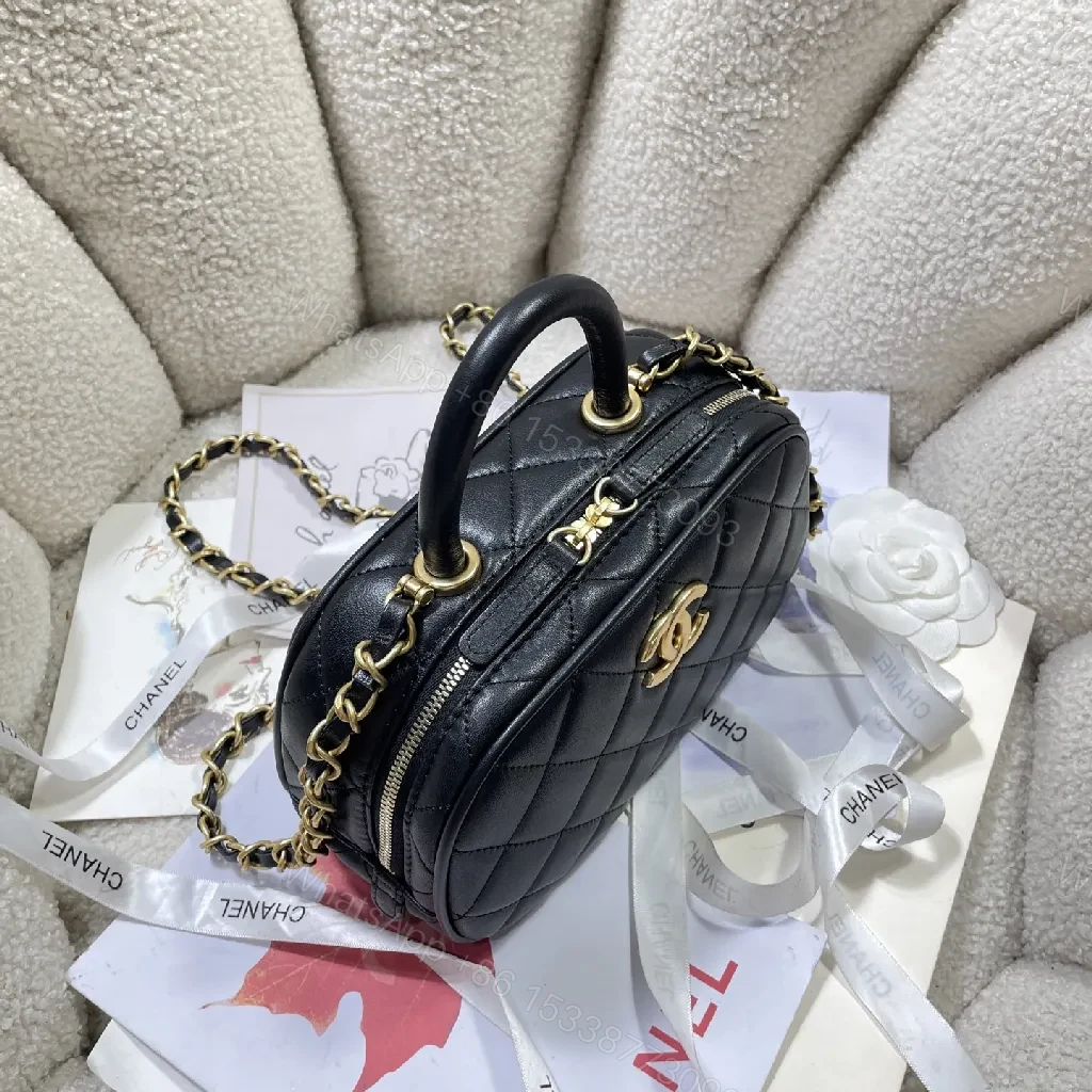 View 3 of Compact Black Quilted Handbag with Gold Logo Chain
