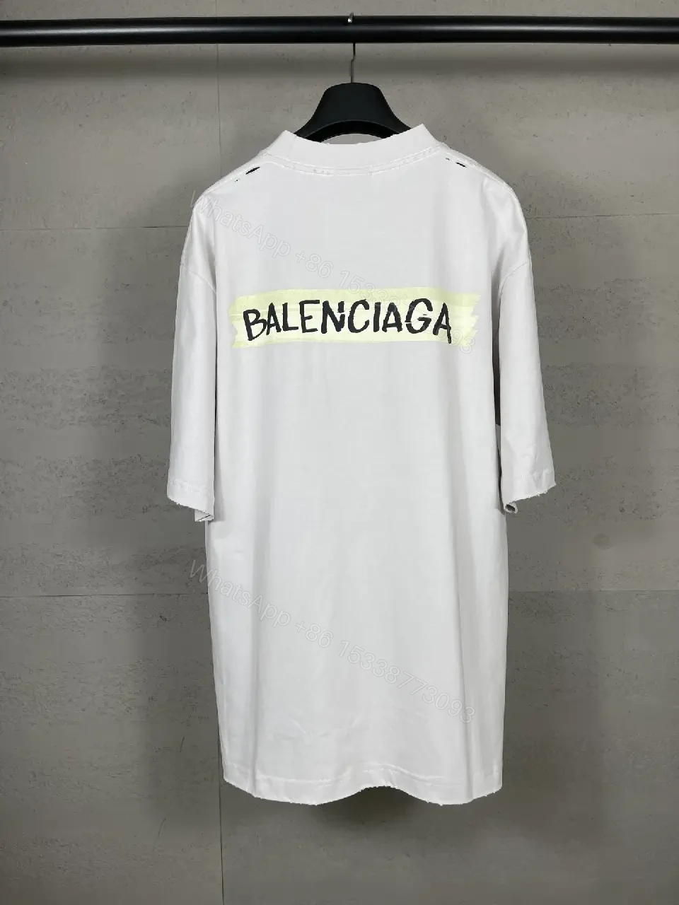 View 9 of Oversized White Tee with Signature Patch - Minimalist Luxe