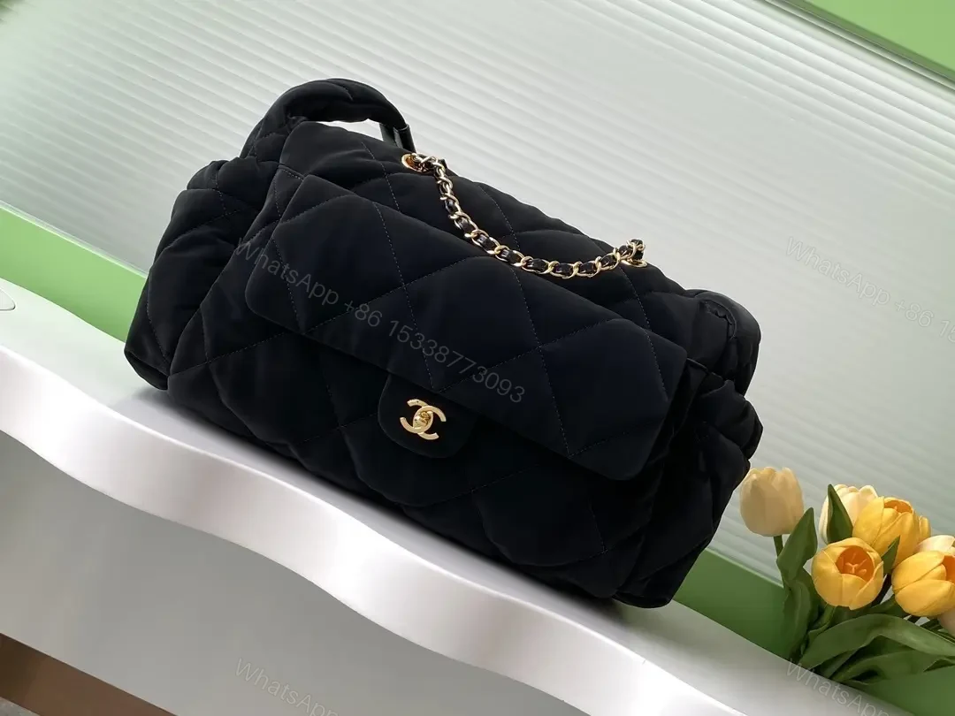 Quilted Black Bag with Gold Chain - Compact Chic Signature — view 1