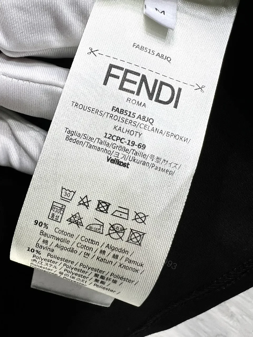 View 7 of Bold Black Tee with Red Fendi Logo Film-Glow