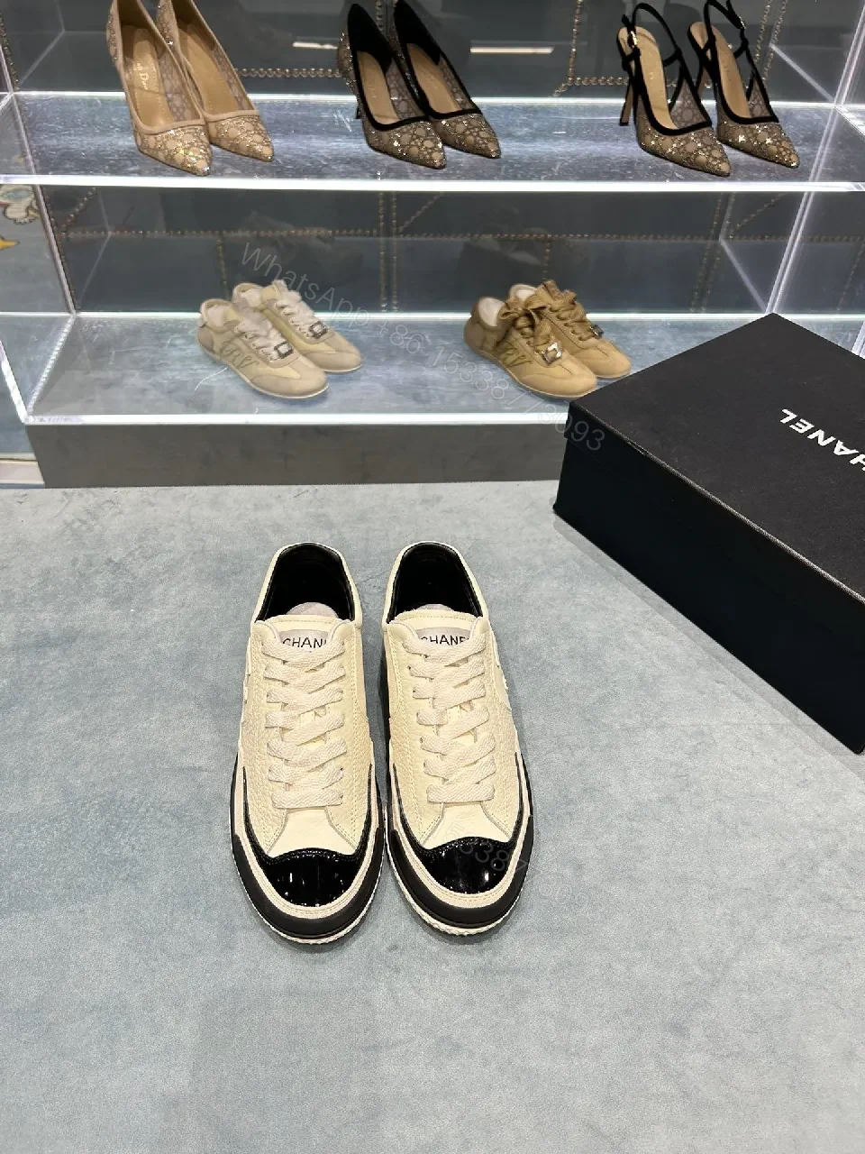 View 4 of Cream Leather Sneaker + Subtle Chanel-Inspired Detail + High-Top Comfort + Timeless Glossy Toe + Sneaker
