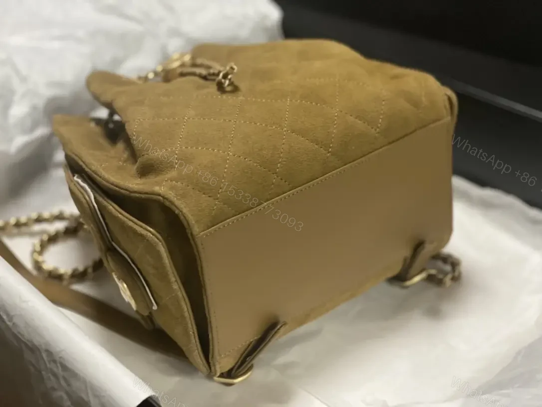 View 7 of Quilted Suede Bucket Bag with Gold Crest Detail