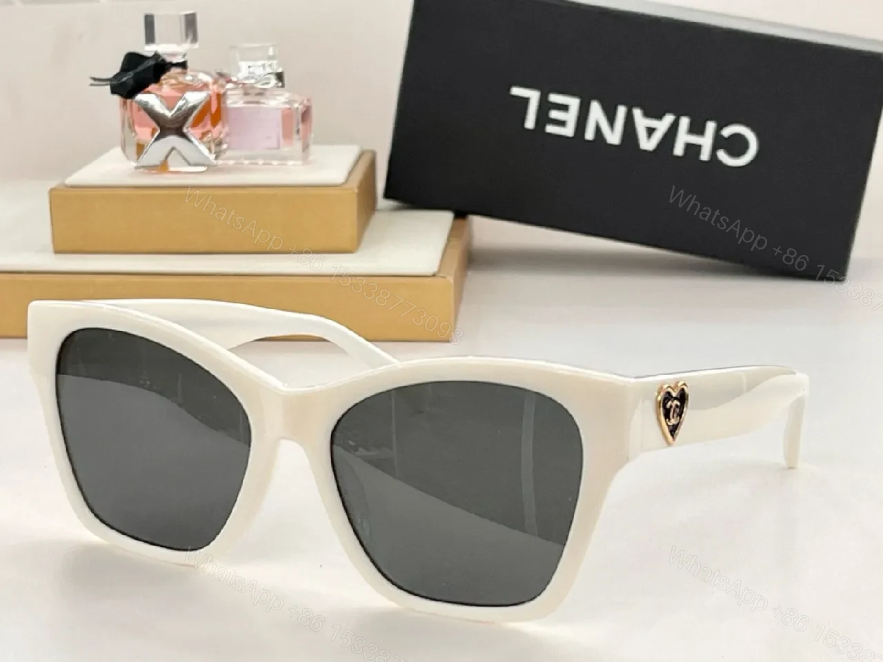 View 2 of Black Cat-Eye Sunglasses with Gold Heart Detail - Premium Acetate
