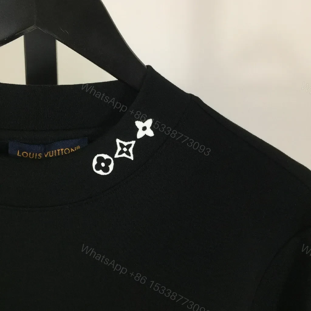 View 5 of Minimalist Black Sweatshirt with Subtle Monogram Accent