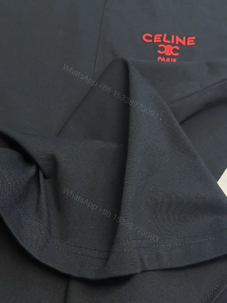 View 9 of Minimalist Black Tee with Red Pocket Detailing - Premium Unisex Tee