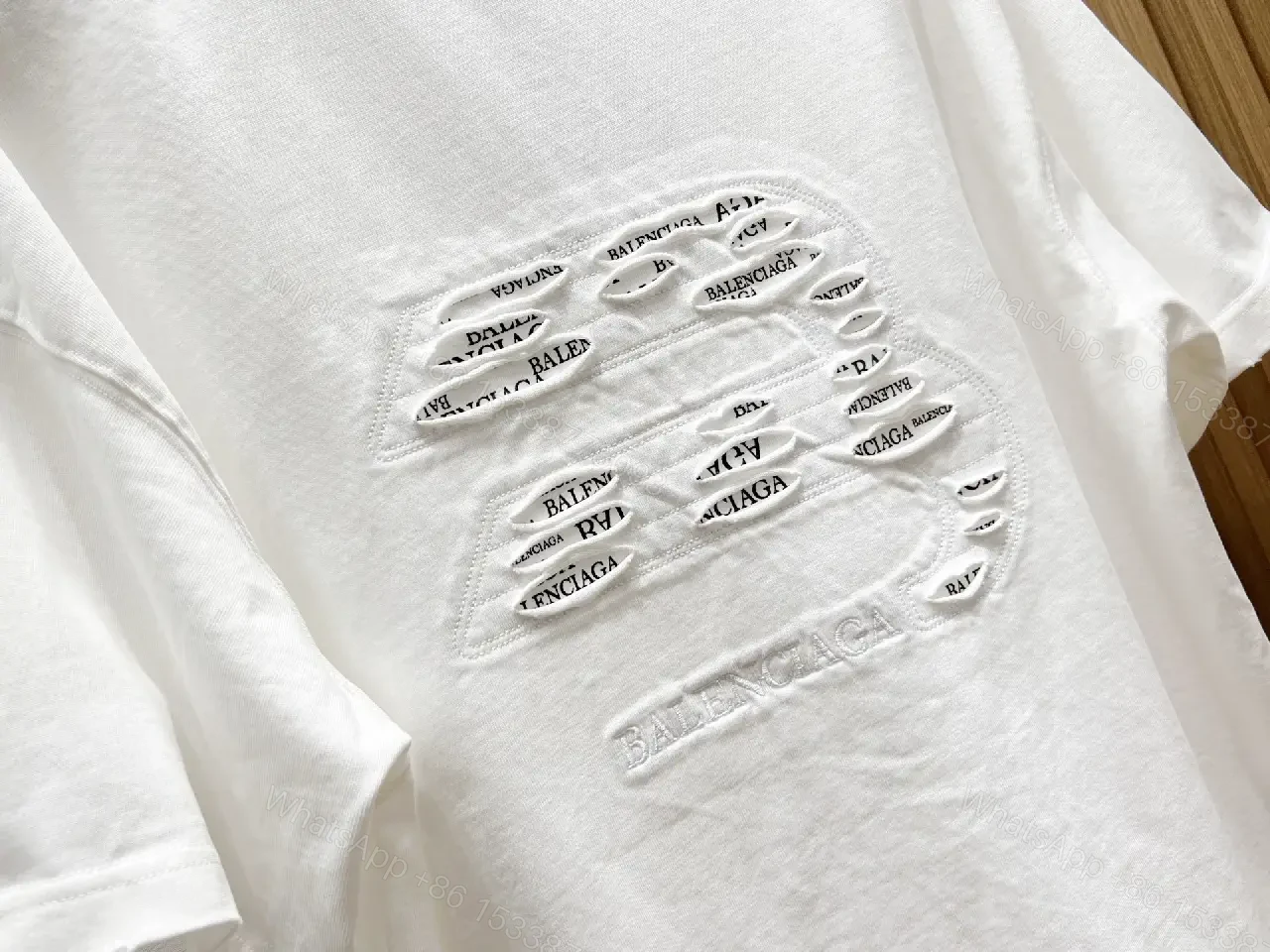 View 5 of White Cotton Minimalist Logo Tee with Subtle Hardware Details