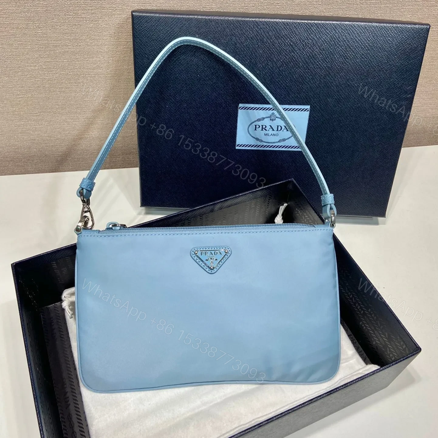 View 2 of SHOULDER BAG 24 WITH TRIANGLE LOGO IN SKY BLUE RE-NYLON FABRIC