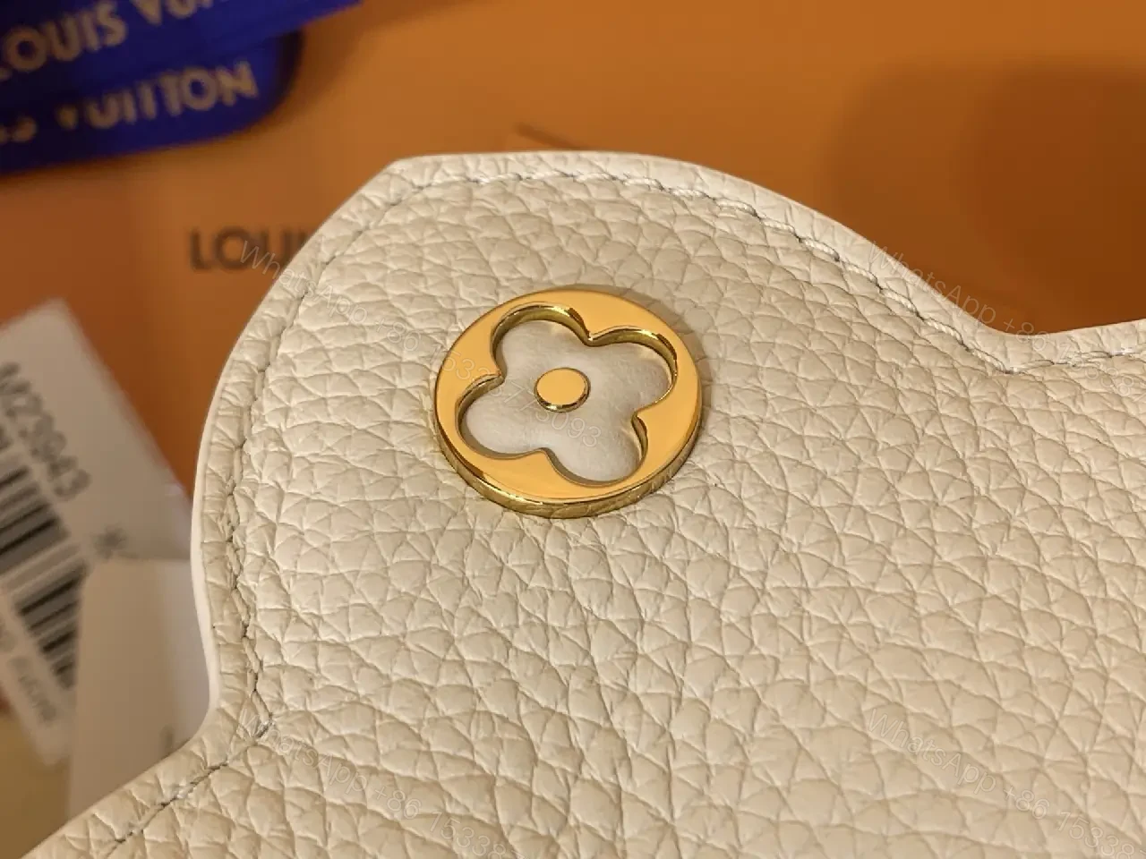View 6 of Chic Textured Leather Mini Bag with Gold Emblem