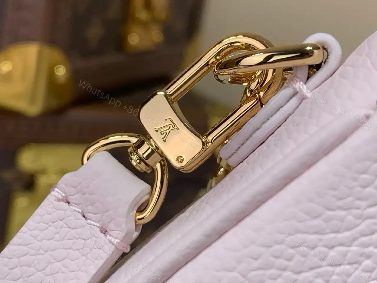 View 10 of Light Pink Pebbled Leather Shoulder Bag with LV Monogram Pattern