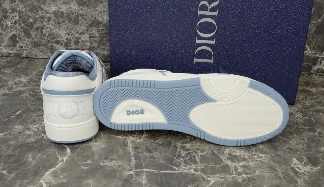 View 3 of Soft-White Leather Sneaker with Blue Accents and Signature Texture