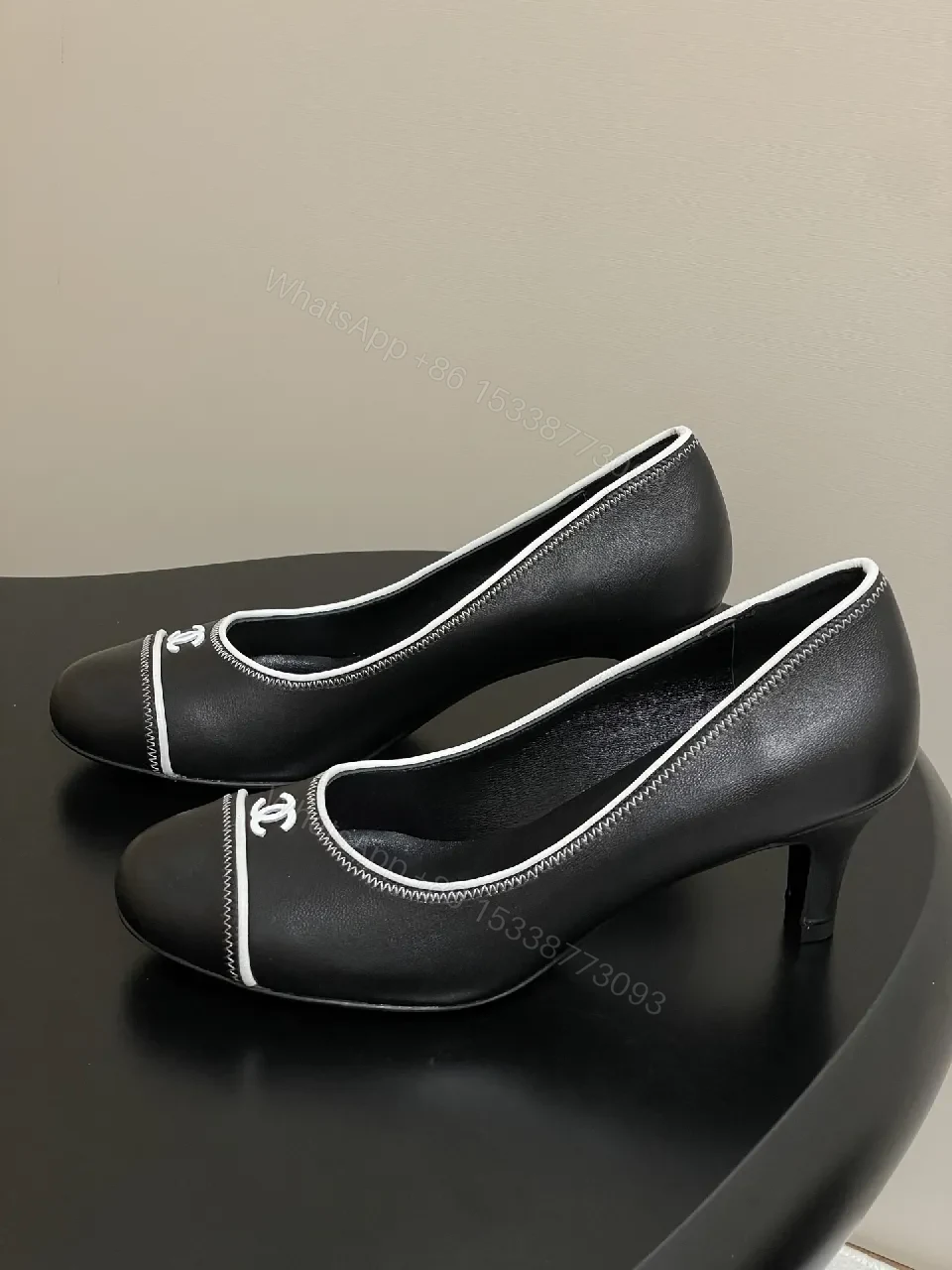 View 7 of Black Leather Kitten-Heel Pumps with Signature Detailing