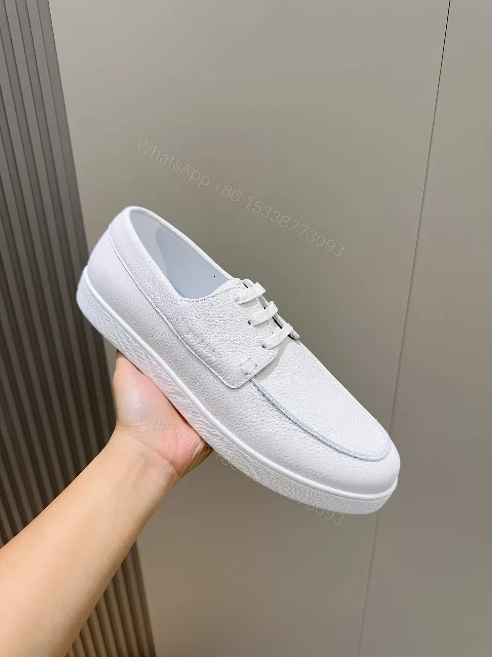 View 5 of Minimalist White Leather Low-Top Sneakers with Subtle Luxury Details
