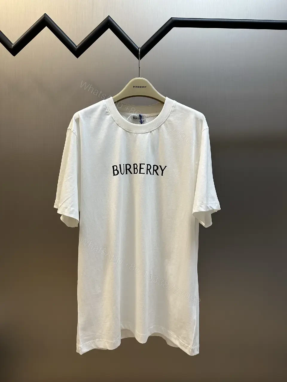 View 9 of Minimalist Burberry-Style White Cotton Tee: Elevated Everyday Comfort