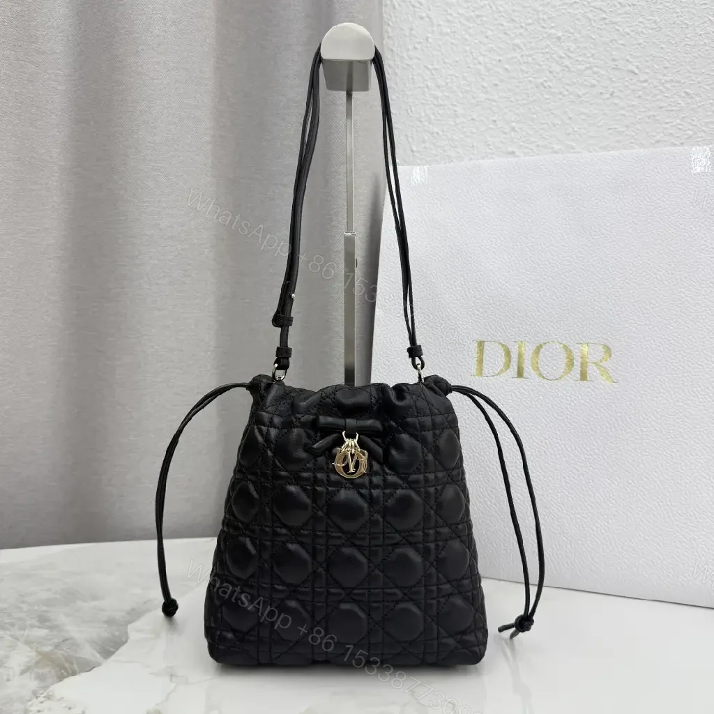 View 6 of Quilted Black Drawstring Bucket Bag with Gold Hardware