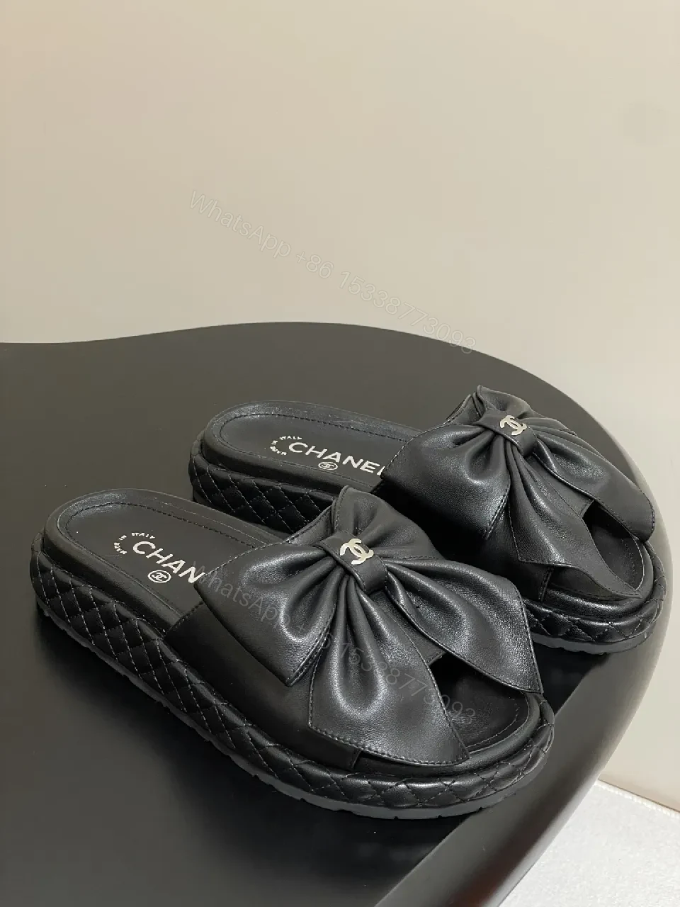Chic Black Quilted Slides with Bow Detail - Luxury Casual Platform — view 1
