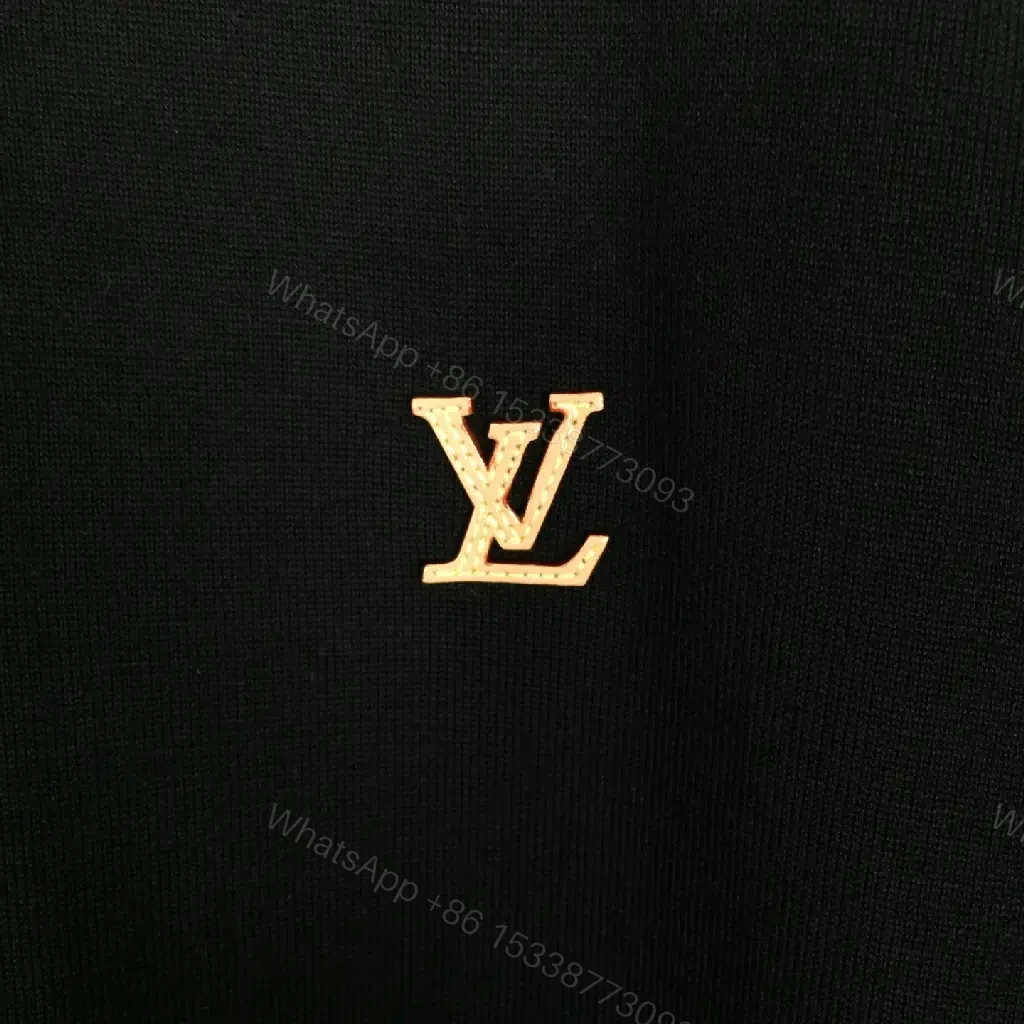 View 7 of Solid Black Polo Shirt with Gold LV Logo, Short Sleeves, Classic Collar