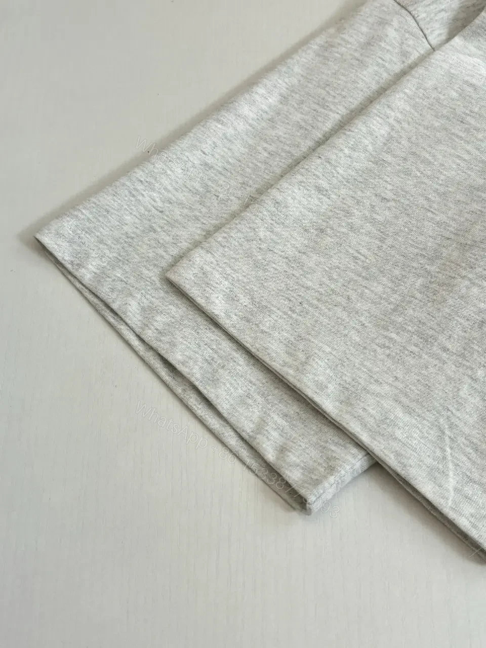 View 10 of Grey Heather Cotton Crewneck Tee — Subtle Luxe Logo, Everyday Comfort