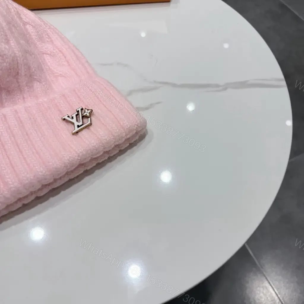 View 3 of Pastel Knit Beanie with Silver Emblem – Luxe Everyday Accessory