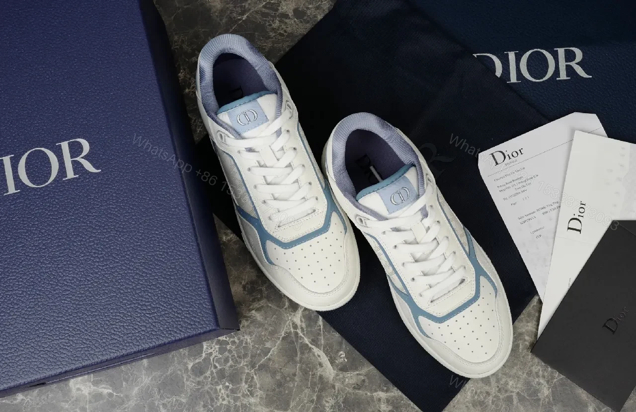 View 4 of Soft-White Leather Sneaker with Blue Accents and Signature Texture