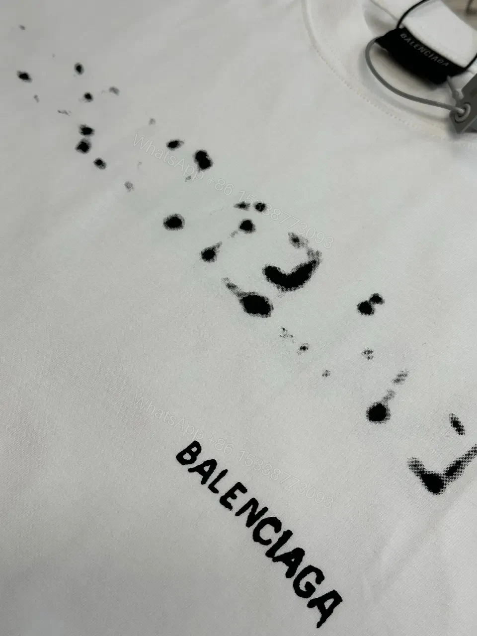 View 11 of Oversized Graphic Tee with Subtle Distress and Logo – Premium Cotton