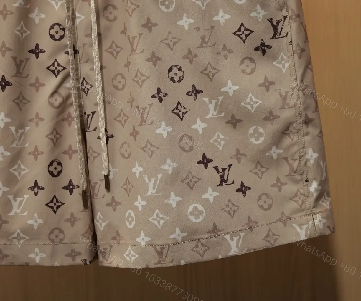 View 2 of Beige Monogram Print Drawstring Swim Shorts