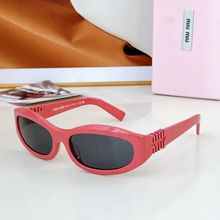 View 5 of Chic Black Miu Miu Sunglasses with Gold Accent - All-Day Shield