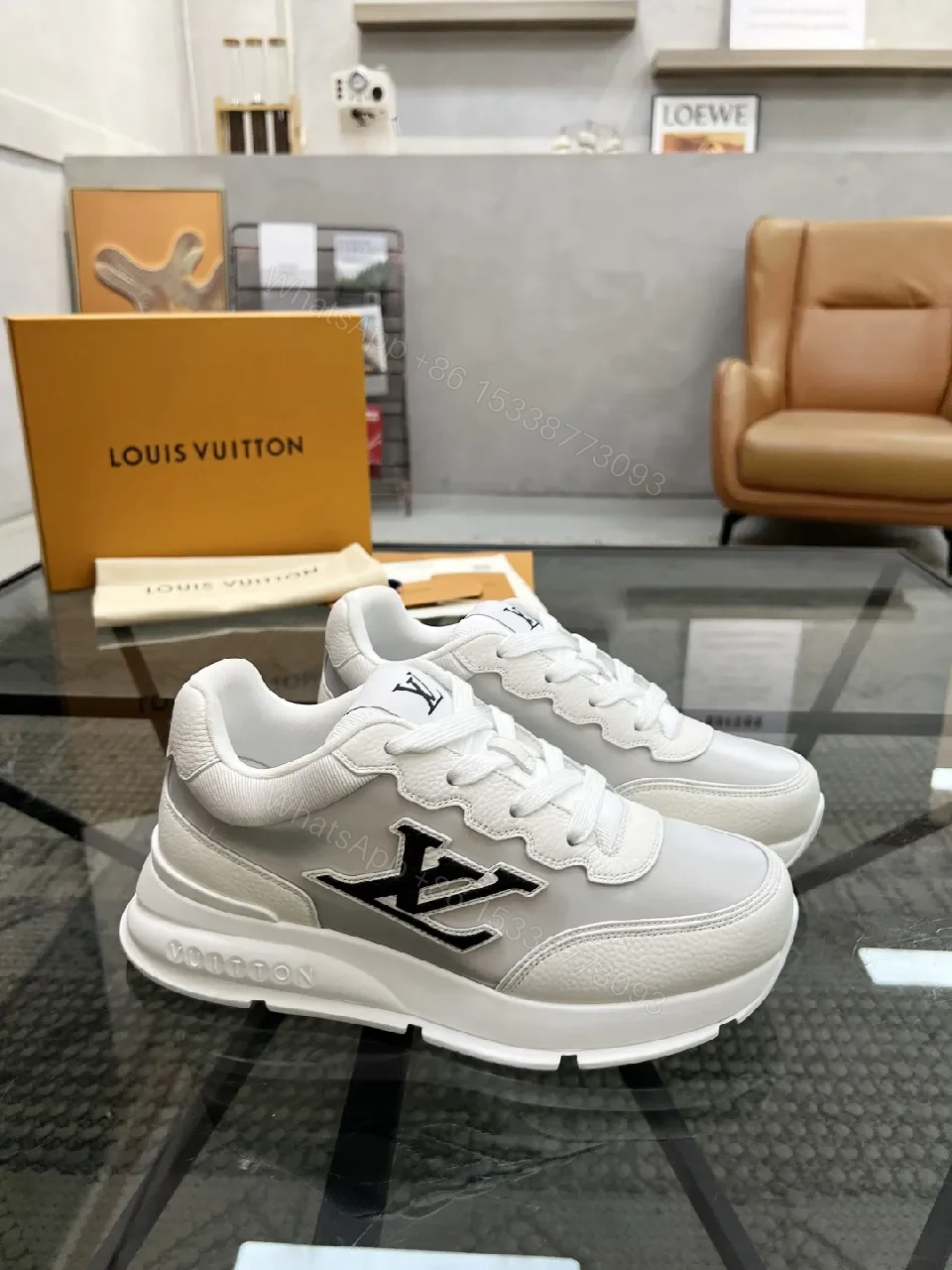 View 2 of White Leather Minimalist Luxe Sneakers with LV Detail