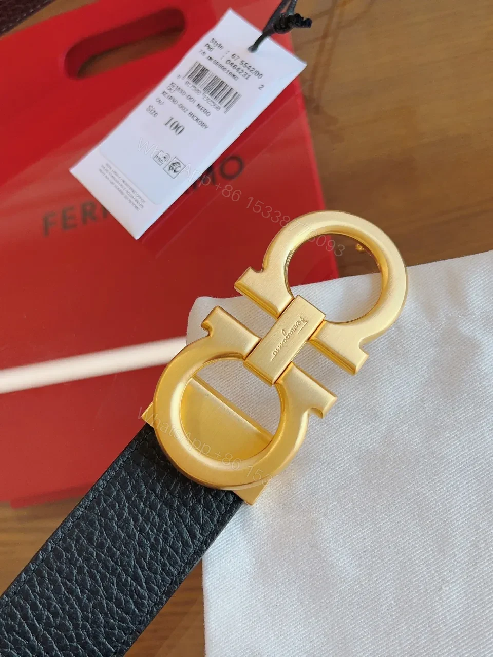 View 2 of Chic Black Leather Belt with Gold Interlocking Buckle