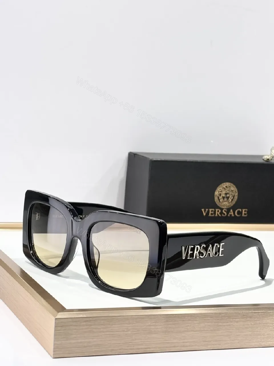 Bold Black Statement Sunglasses with Logo-Injected Glamour — view 1