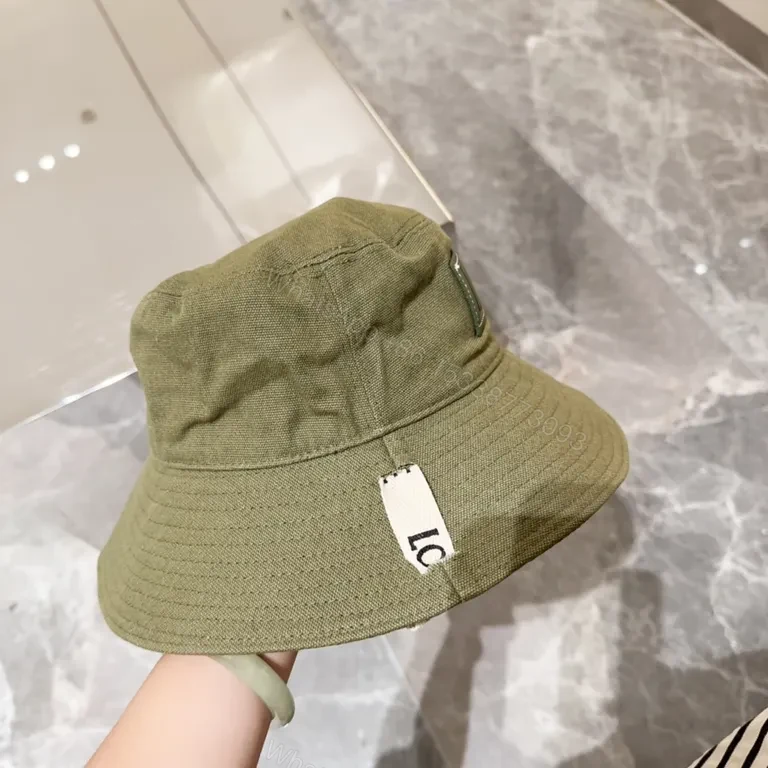 View 9 of Olive Canvas Bucket Hat: Subtle Luxury, LOEWE Patch