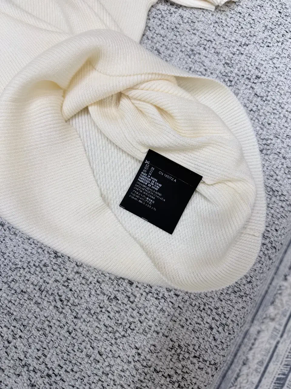 View 5 of Minimalist Ivory Knit Tee with Prominent Branding