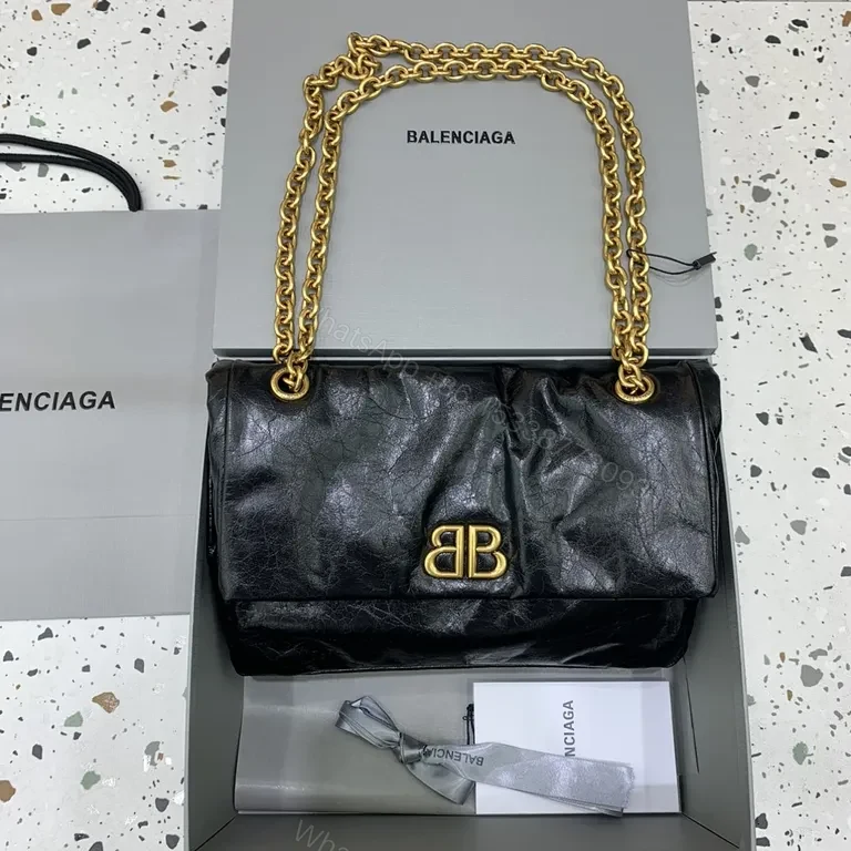 Chic Black Leather Shoulder Bag with Gold Chain Straps — view 1