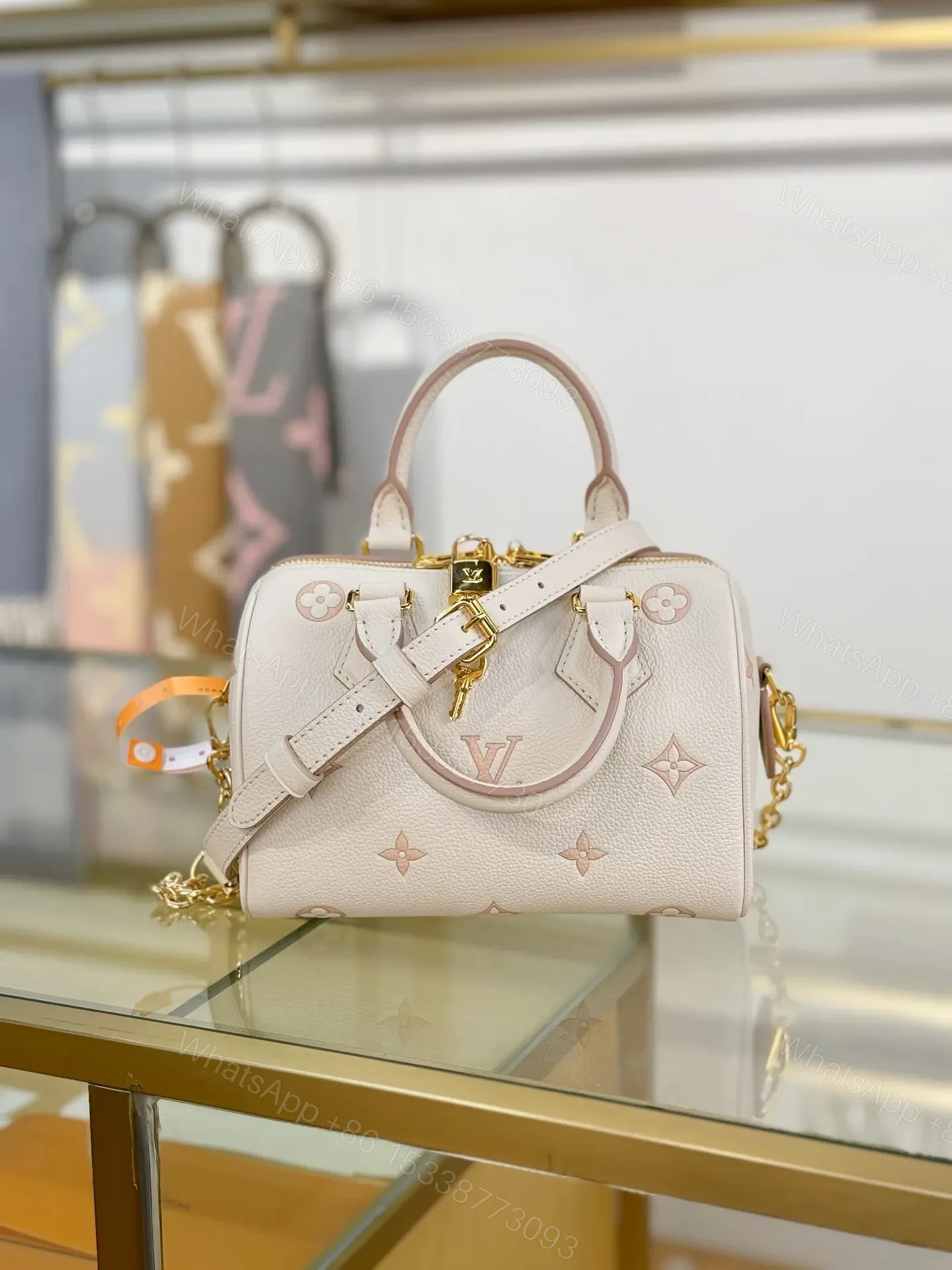 View 6 of Louis Vuitton Monogram Empreinte Bicolor Speedy Bandoulière 20