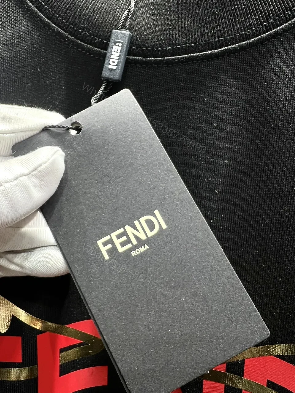View 3 of Bold Black Tee with Red Fendi Logo Film-Glow