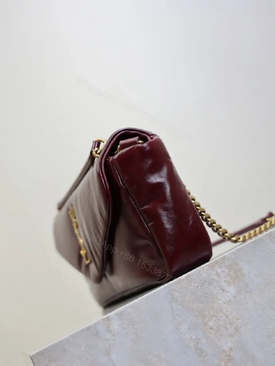 View 9 of Burgundy Calfskin Compact Shoulder Bag with Gold Hardware