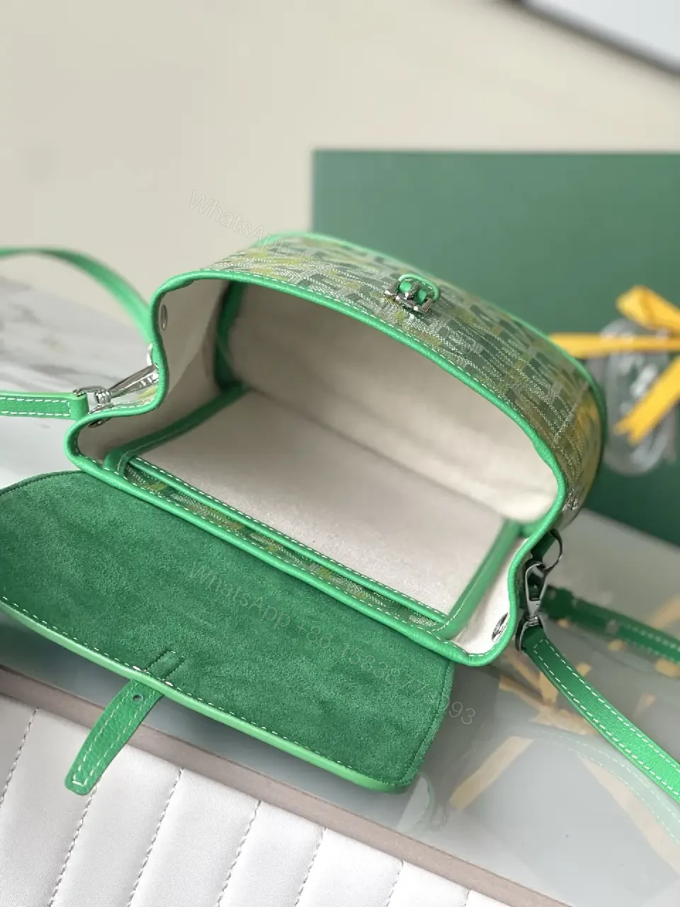 View 3 of green leather mini backpack with monogram pattern and luxury green trim for everyday use