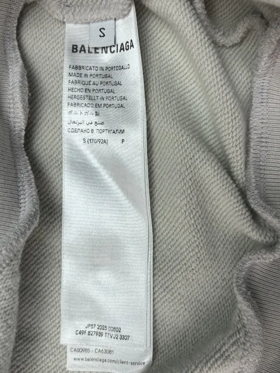 View 8 of Neutral Cotton Blend Minimalist Hoodie with Subtle Logo (Unisex)