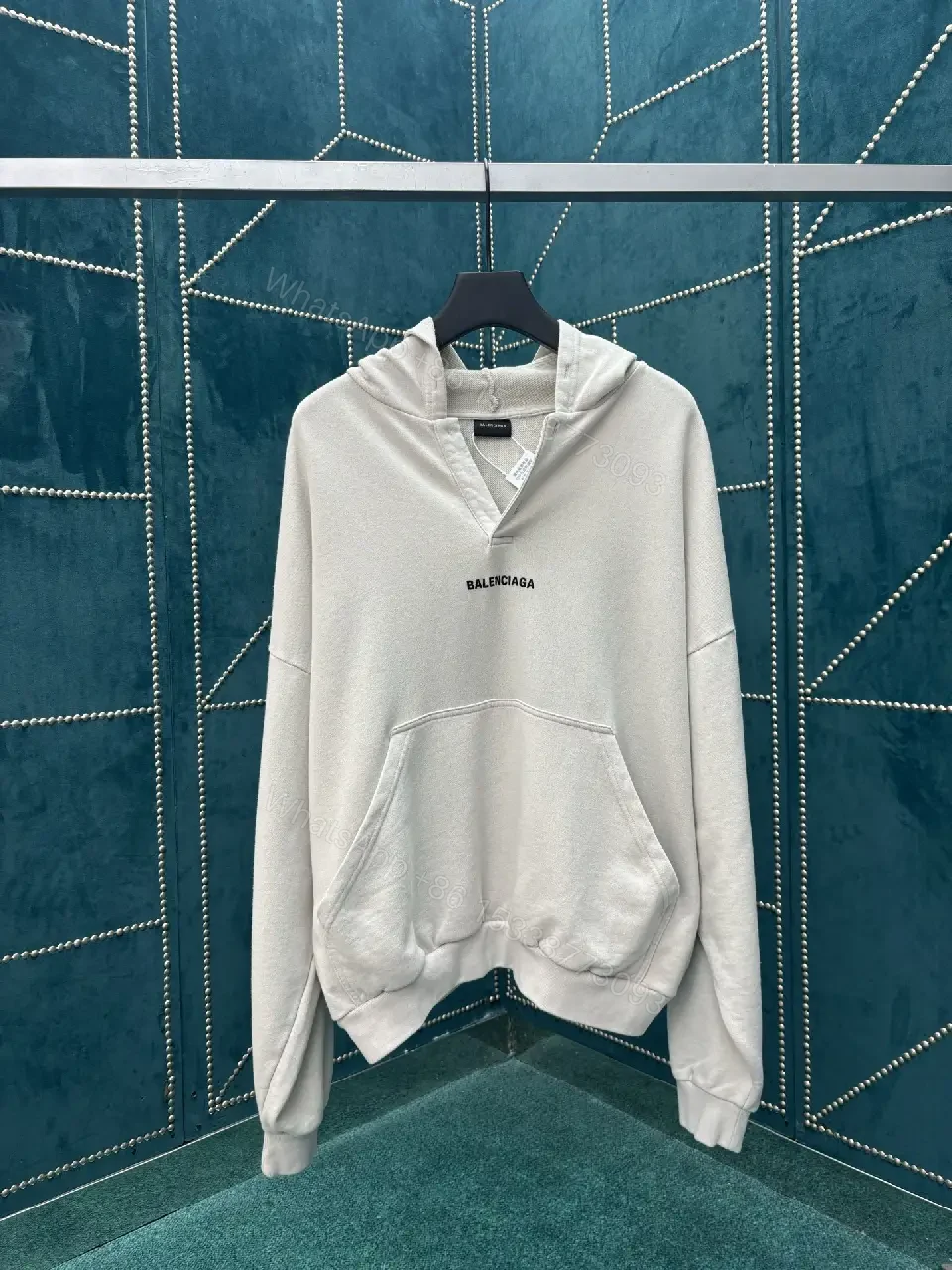 View 4 of Neutral Cotton Blend Minimalist Hoodie with Subtle Logo (Unisex)