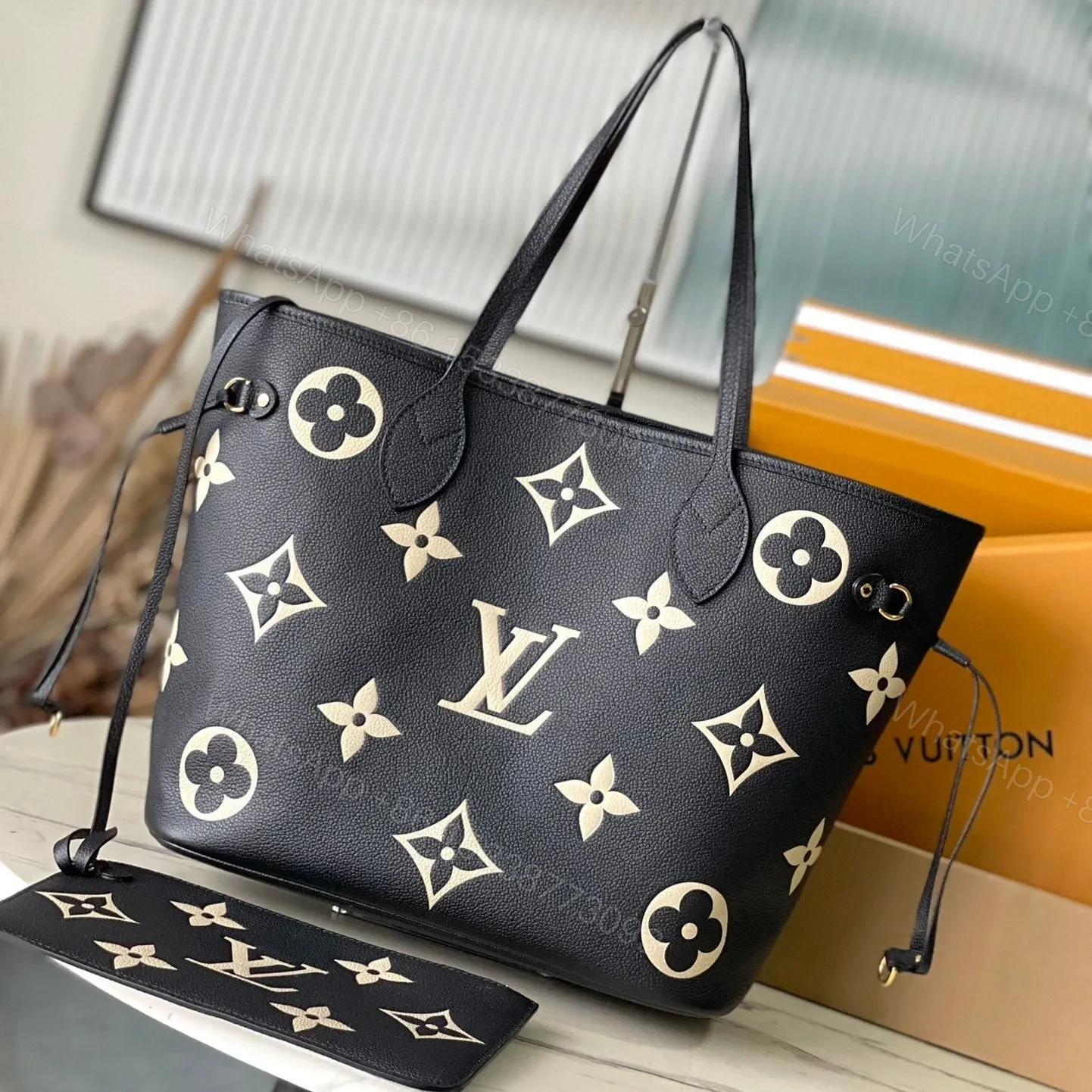 LV NEVERFULL MM IN BLACK CREAM MONOGRAM EMPREINTE LEATHER — view 1