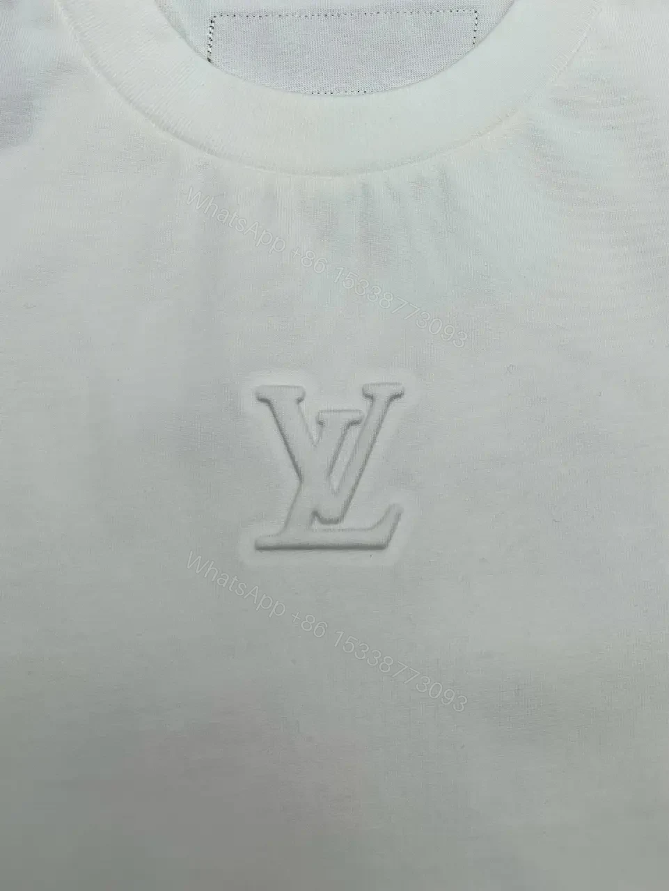 View 11 of Minimalist Luxe White Crewneck with Subtle Embossed DetailTop