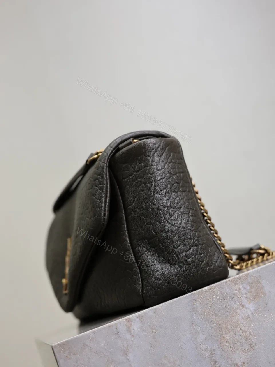 View 2 of Textured Leather Envelope Bag: Black + Gold Accent, Compact Luxury Shoulder Bag
