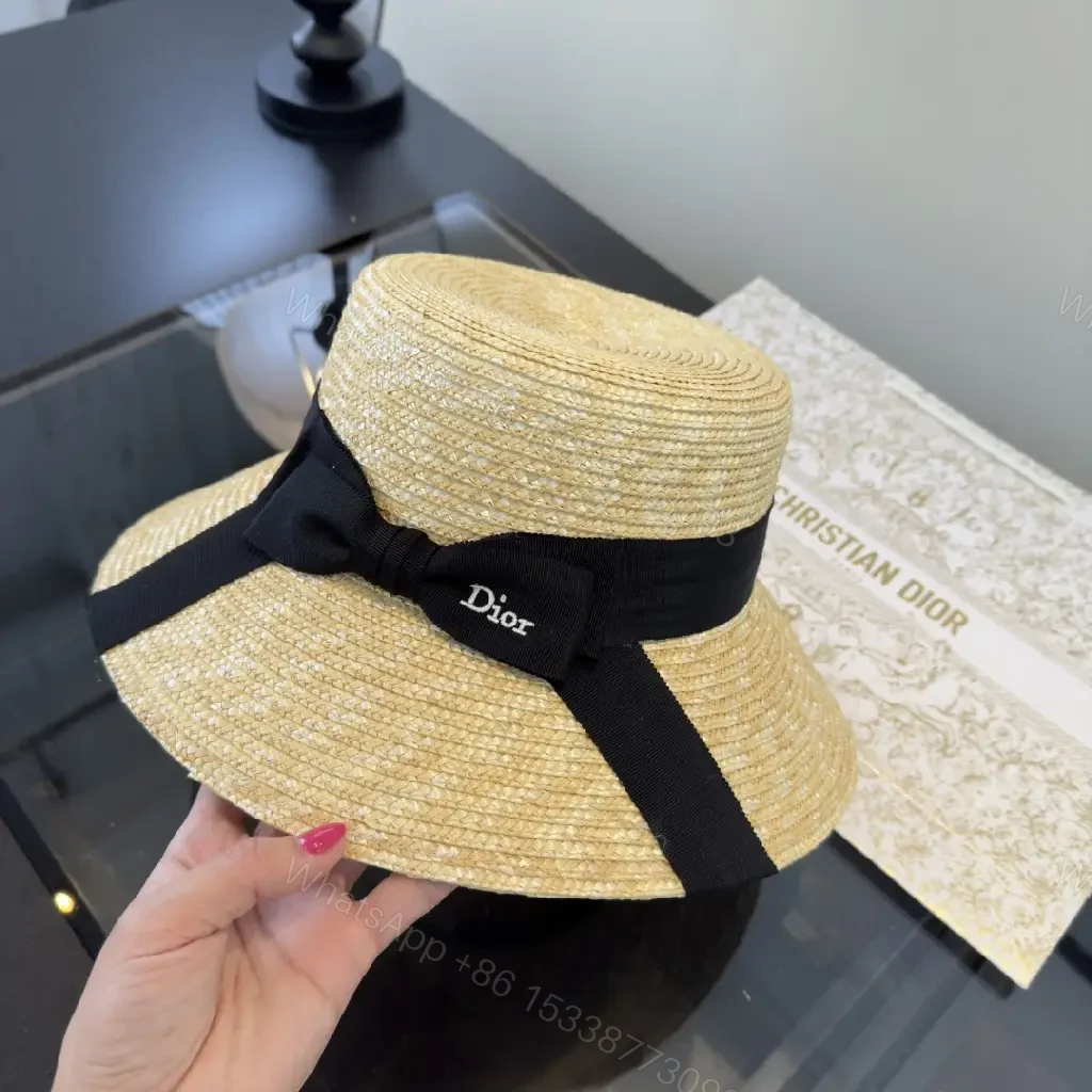 View 8 of Natural Straw Wide-Brim Hat with Black Ribbon Accent
