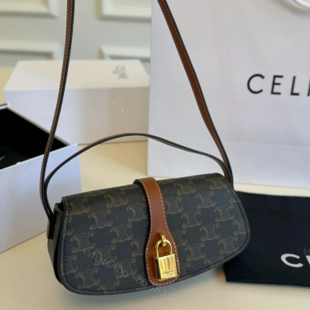 View 2 of CELINE CLUTCH ON STRAP TABOU IN TRIOMPHE CANVAS AND CALFSKIN TAN 20CM 10I592DQ2 04LU