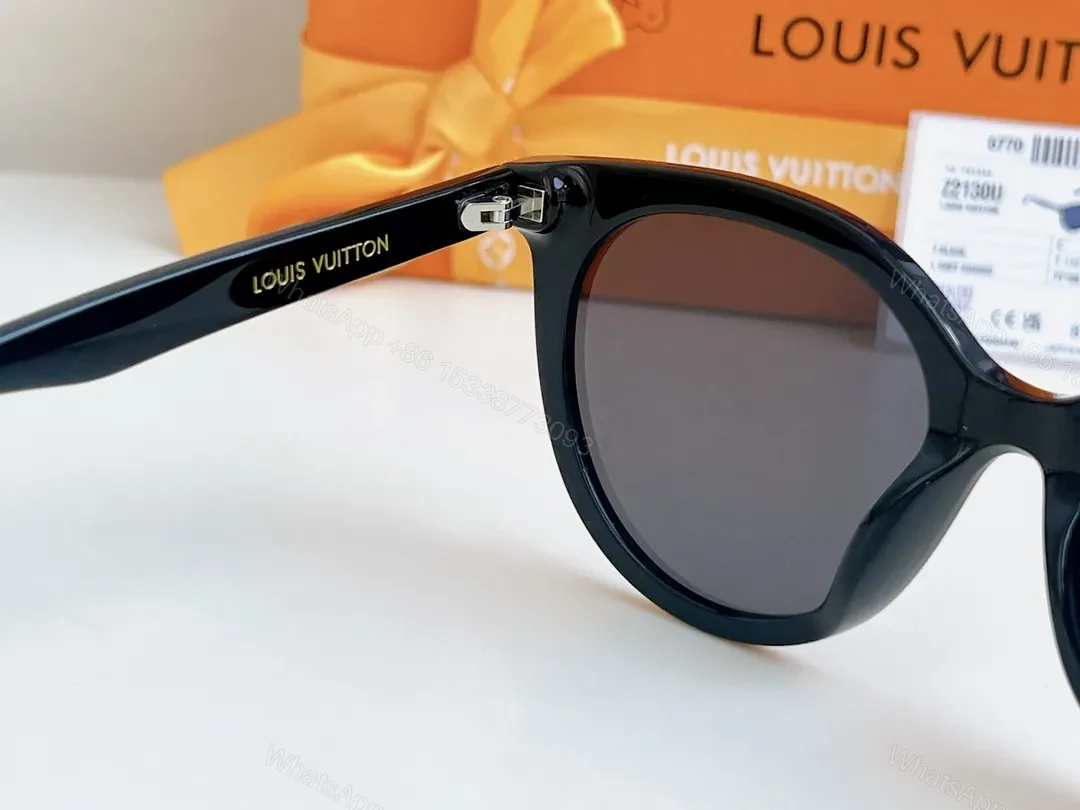 View 7 of Sleek Black Round-Frame Sunglasses with LV Accents