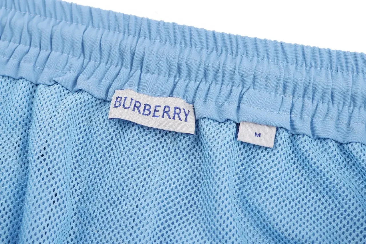View 3 of Light Blue Cotton-Blend Swim Shorts with Burberry-Check Side Strips