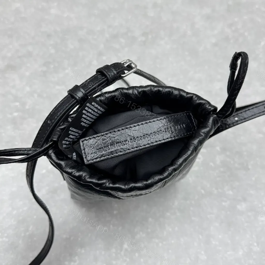 View 6 of Black Leather Drawstring Crossbody Bag - Minimalist Luxe Compact Carry