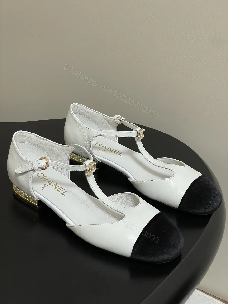 White & Black T-Strap Pumps with Pearl Buckle – Luxe Two-Tone Heels — view 1